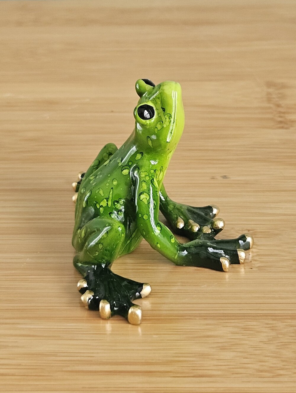 Green Decorative Frog Figurine with Gold-Tipped Toes